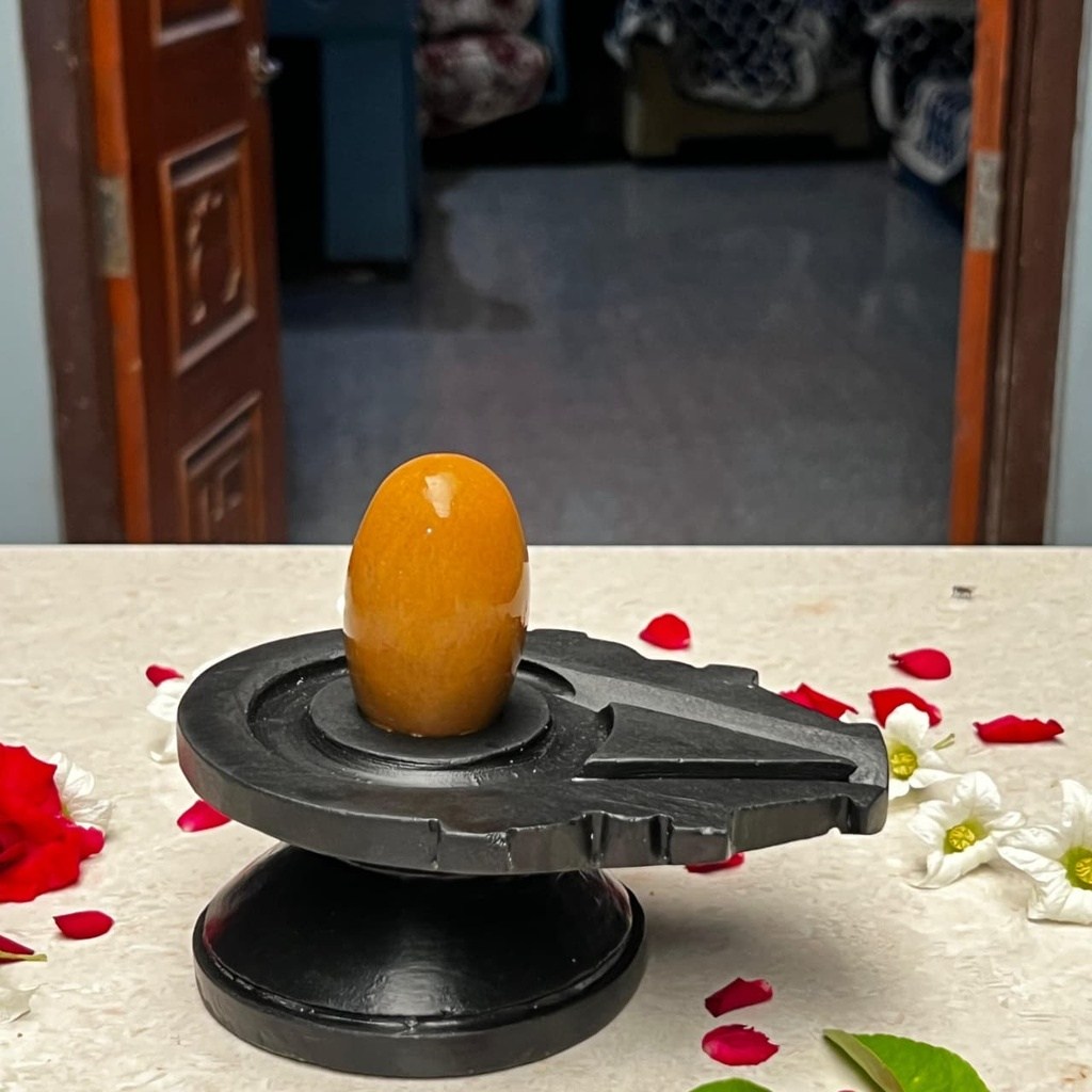 3 Inch Natural Golden Yellow Narmadeshwar Shivling with 6 Inch Black Damru Jaladhari, 3″ height · 6″ Damru Jaladhari