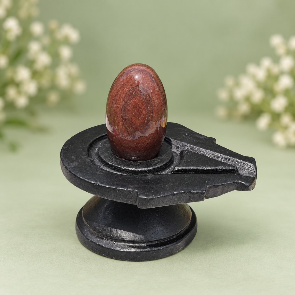 2-inch Narmadeshwar Shivling · Warm Rust Oval, 2″ height · 4″ Jaladhari