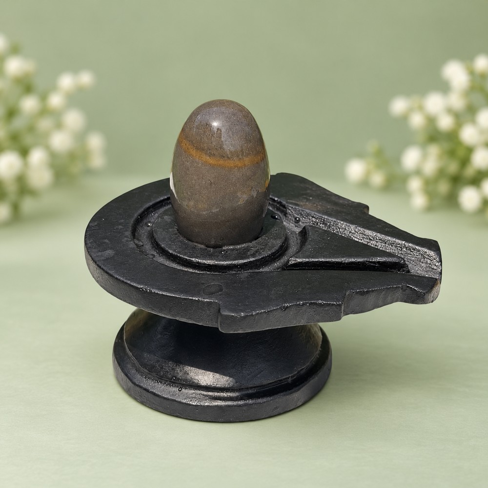 2-inch Narmadeshwar Shivling · Ochre Band on Charcoal, 2″ height · 4″ Jaladhari